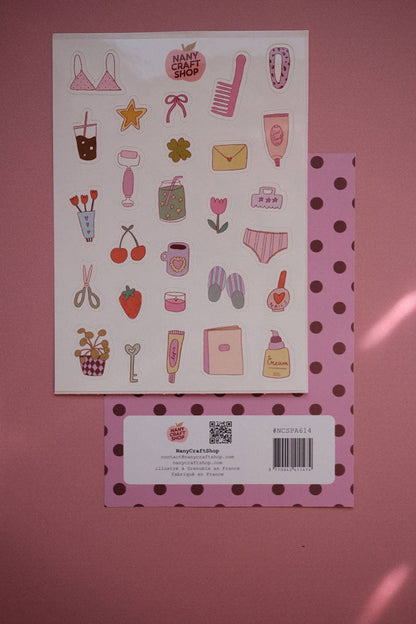 Sticker sheet with assorted girly stickers: clothing, candy, bags, and polka-dot accents