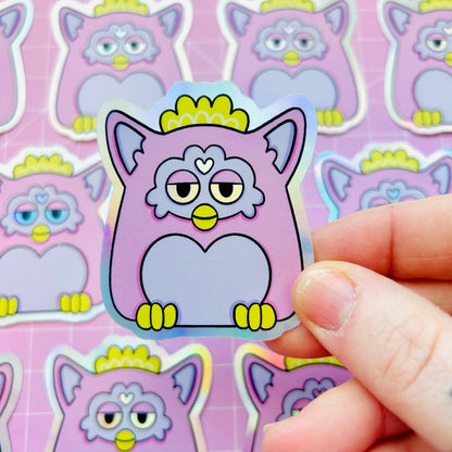 Holographic Furby cat sticker, purple outline with heart nose and yellow eyes