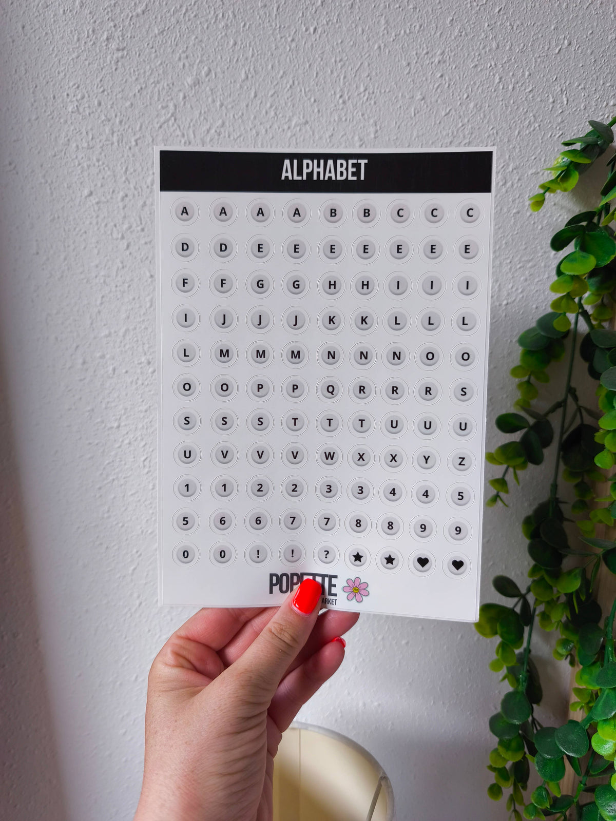 Pearl alphabet sticker sheet held in hand; A–Z letters, numbers, symbols, POPETTE