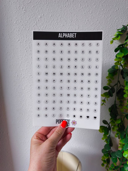 Pearl alphabet sticker sheet held in hand; A–Z letters, numbers, symbols, POPETTE