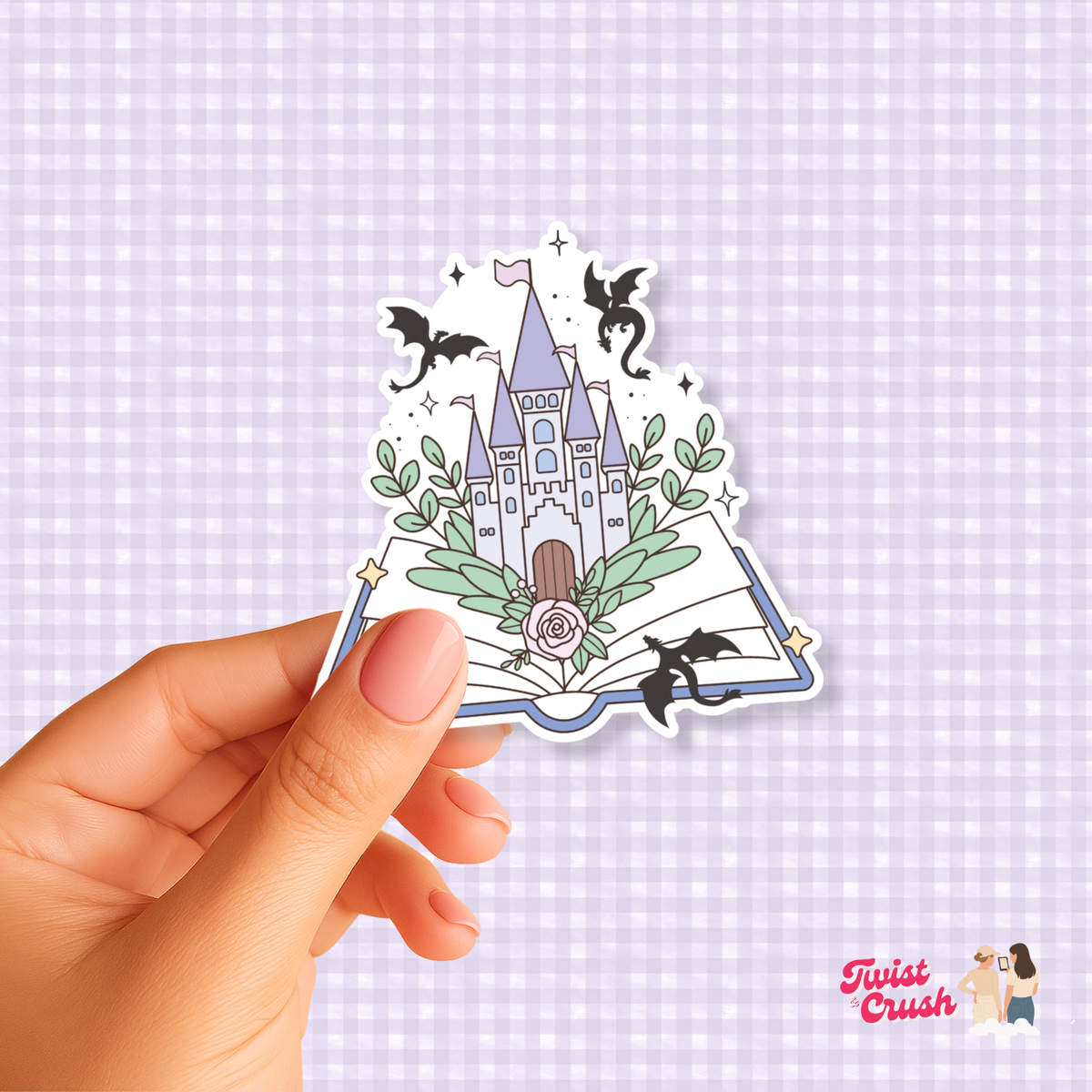 Open-book dragon sticker showing a book, two black dragons, and floral accents