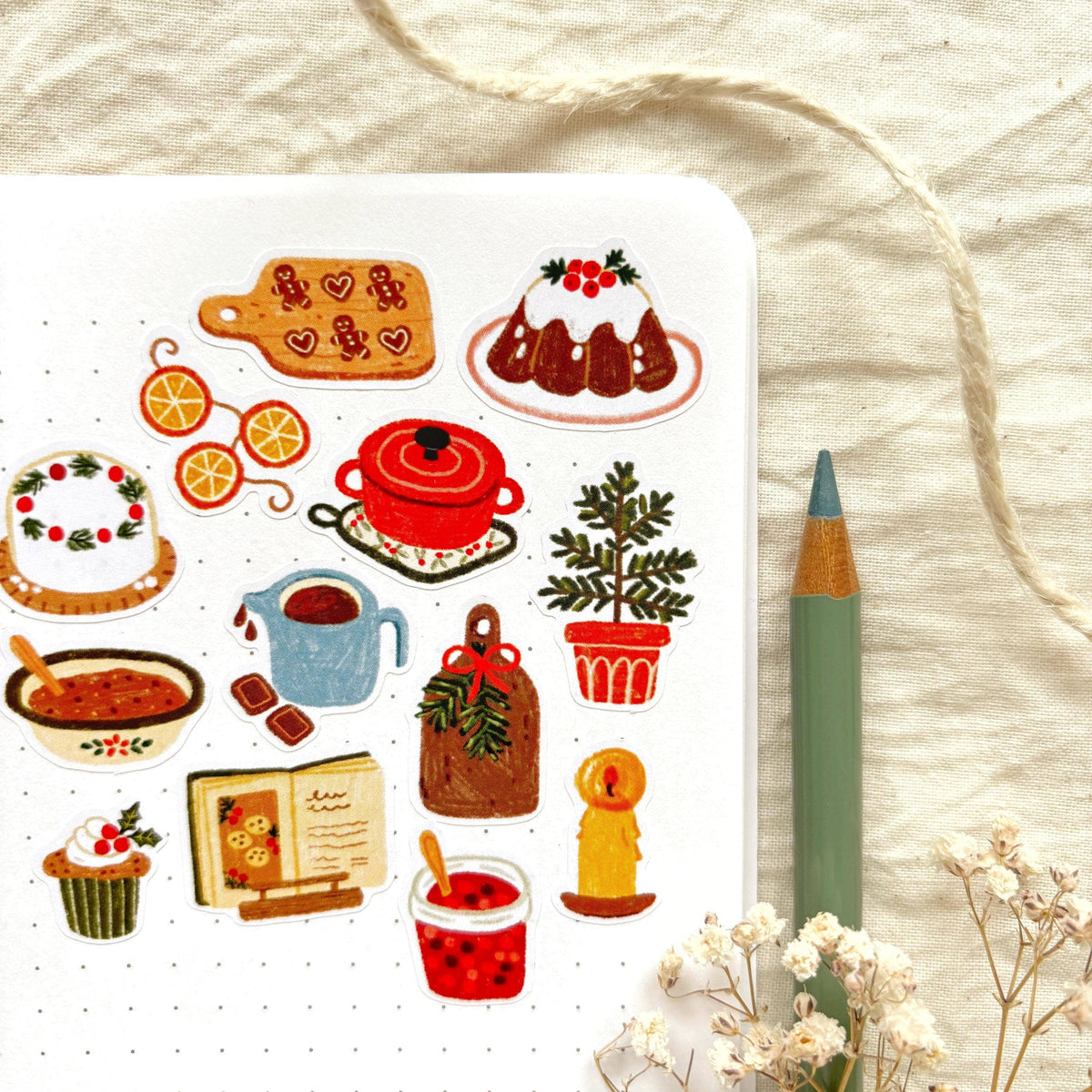Winter baking sticker sheet close-up with teapot, cake slices, cups, cookies, and oranges