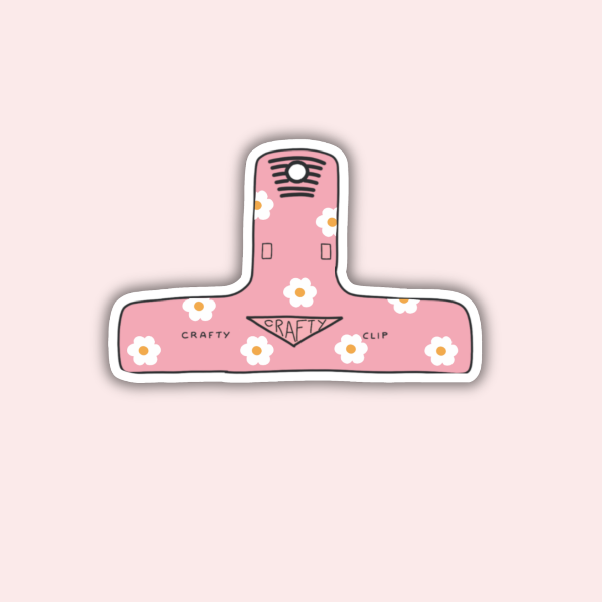 Pink flower-shaped clip sticker with floral pattern and "Crafty Clip" text