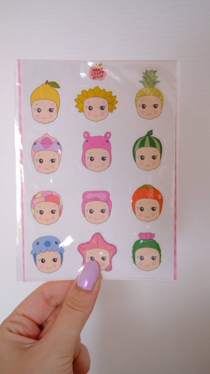 A6 baby summer sticker sheet held in hand, round cartoon baby face stickers