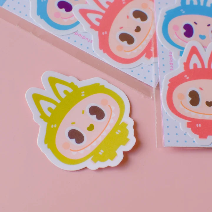Single vinyl sticker of a smiling yellow character face with heart eyes