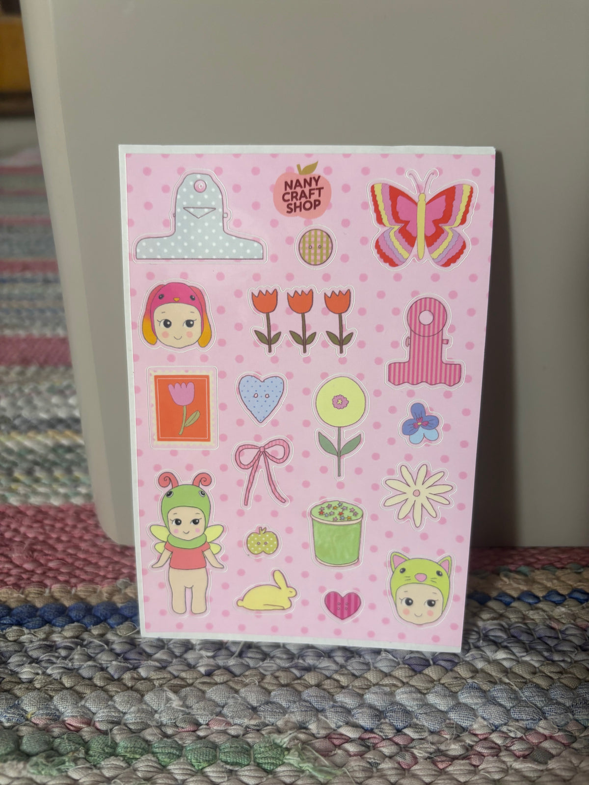 Sticker sheet with pink nursery-themed baby, tulips, hearts, butterfly and tools icons