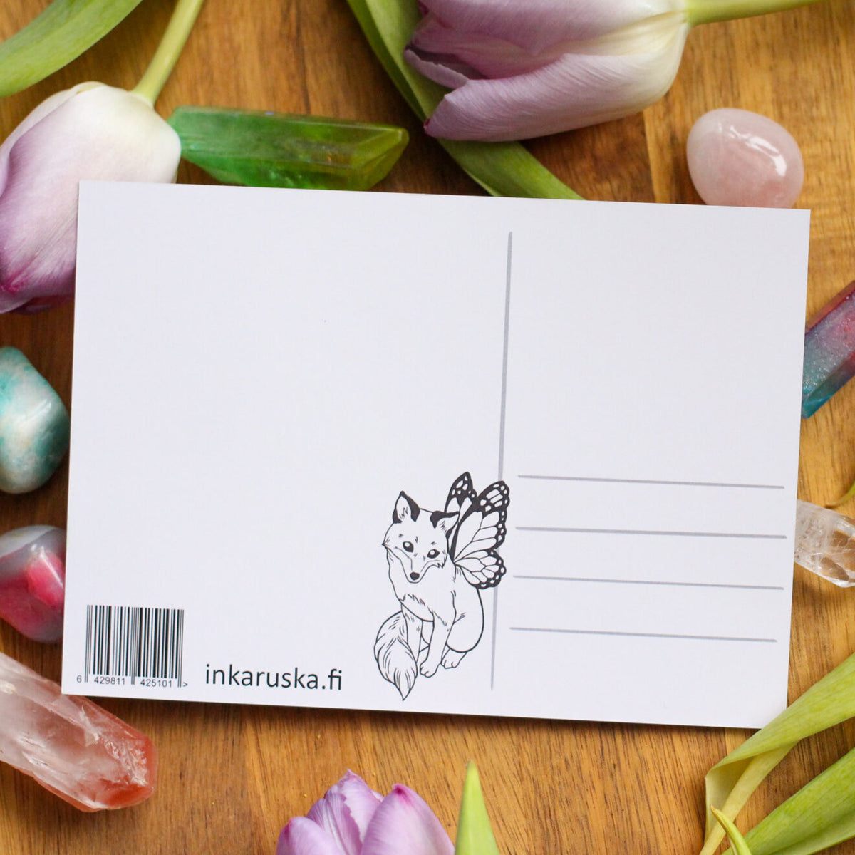 White postcard back with barcode, inkarsuka.fi, and writing lines