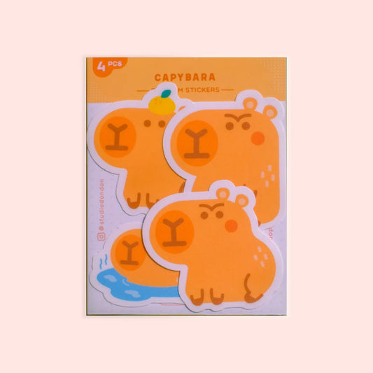 4-pack vinyl capybara stickers, orange cartoon animals shown in package