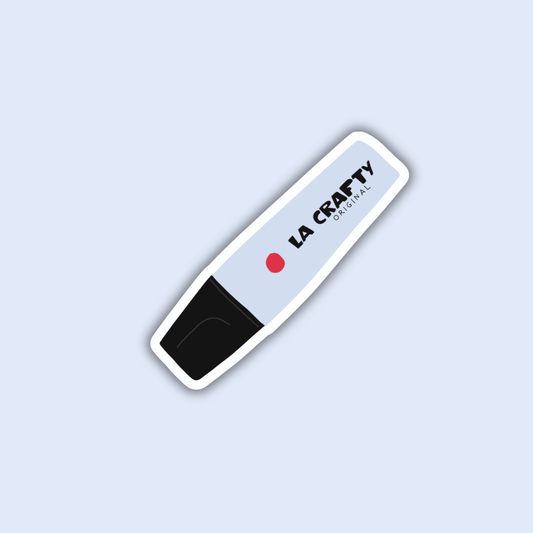 La crafty sticker, white rounded label with black speckle end and red dot logo