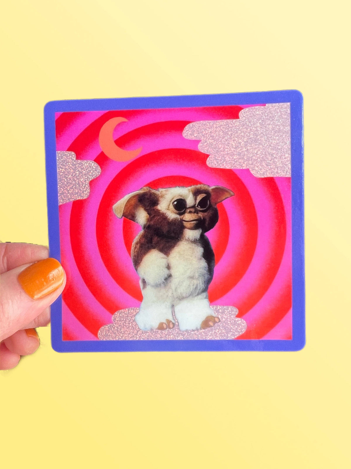 3-inch square Mogwai sticker, blue border, cartoon gremlin dog in red spiral