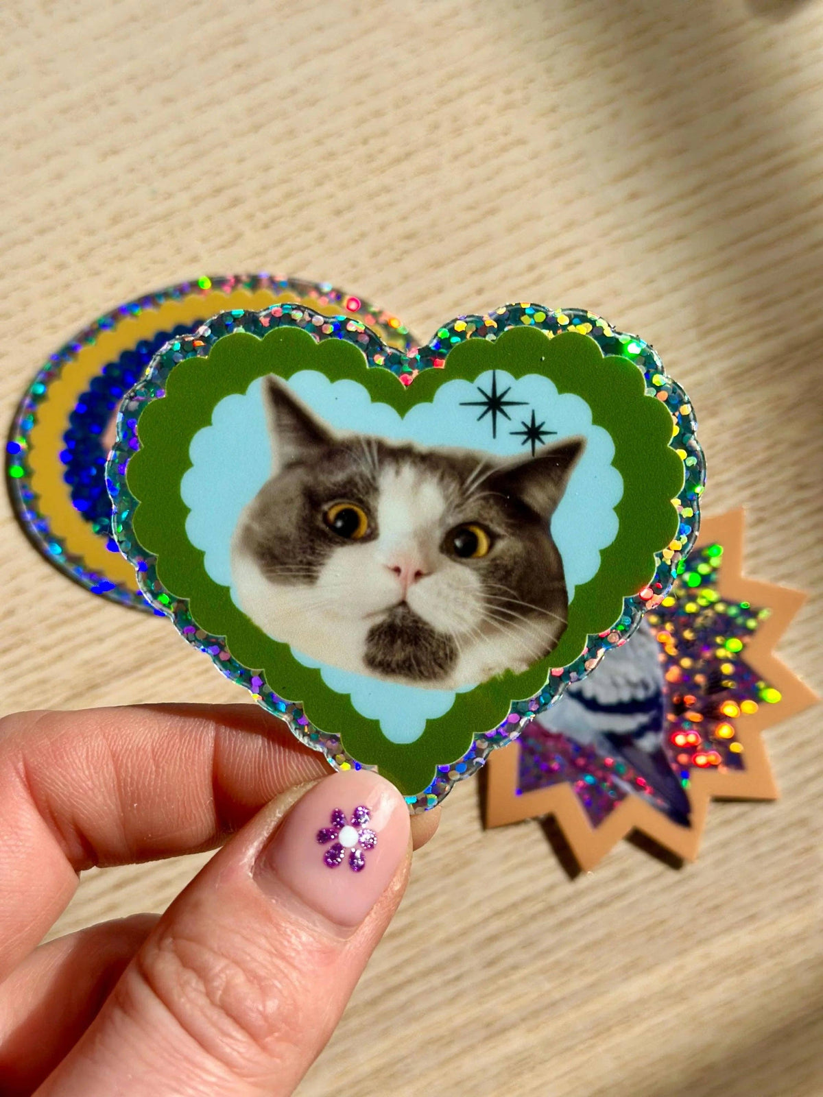 Handheld cat heart glitter sticker with holographic rainbow trim