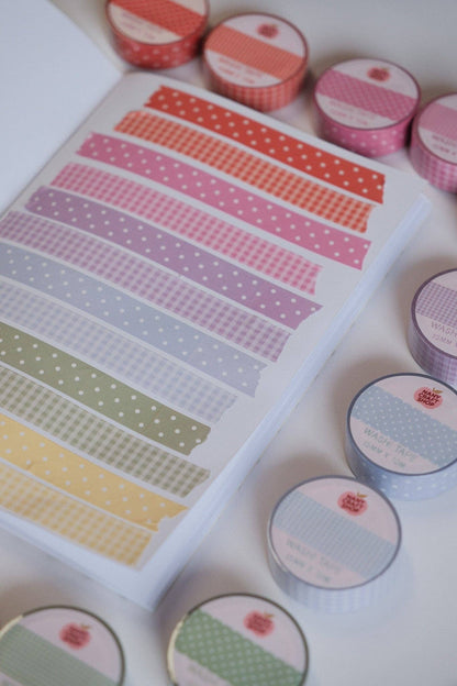 Washi tape strips sheet with pink dot and grid designs in multiple colors