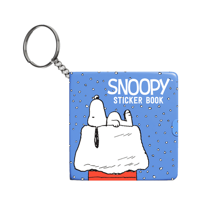 Blue mini sticker book keychain with Snoopy cover and metal key ring, front view