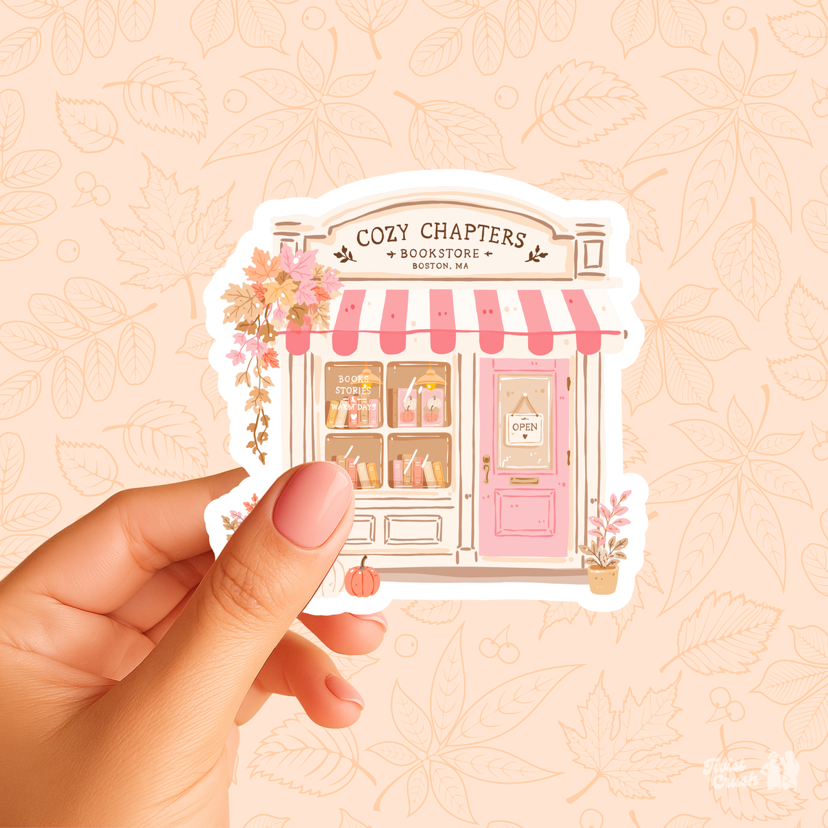 Cozy chapter storefront sticker sheet held in a hand