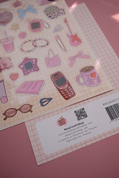 A5 sticker sheet corner with phone, book, sunglasses, jewelry and barcode label