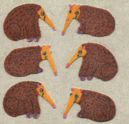 Fuzzy-finish anteater stickers, brown bodies with yellow snouts and curled claws