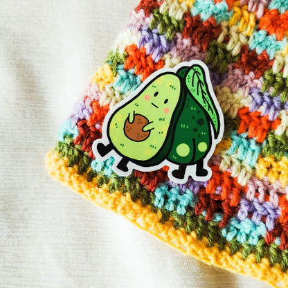 Single waterproof cartoon avocado sticker, lime-green fruit with brown pit and white border