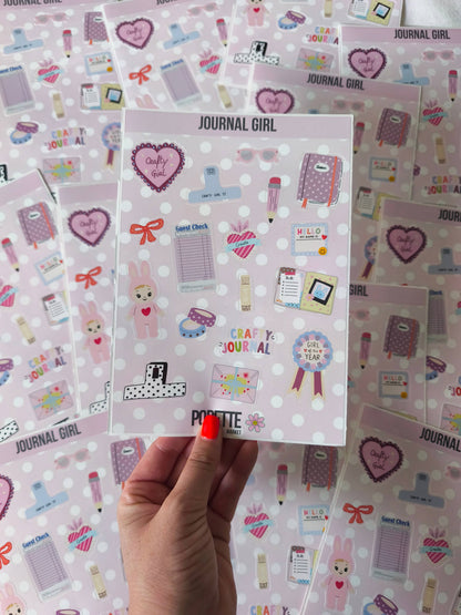 Close-up of A5 journal-themed sticker sheet: hearts, notebooks, pens, and Hello accents