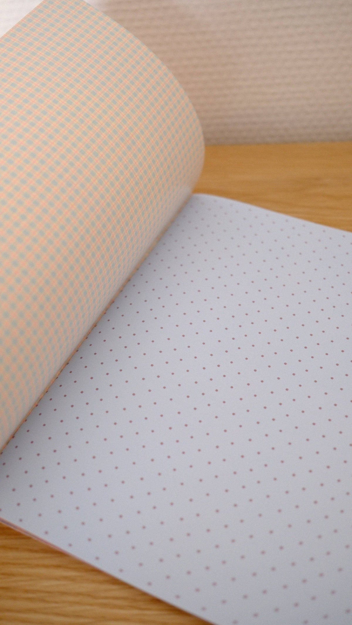 Scrapbook paper sheet with tiny dot pattern on pale lavender and beige