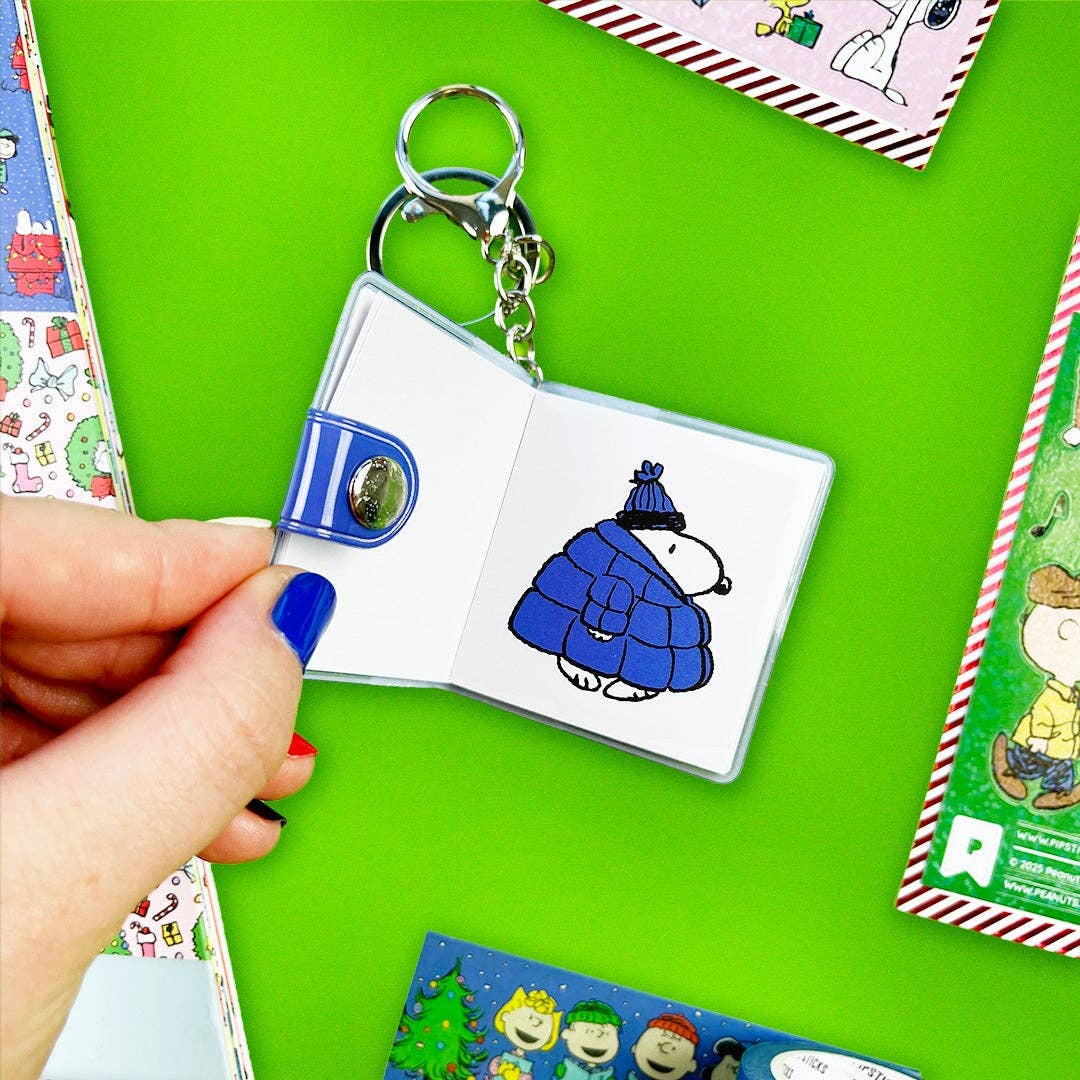 Rectangular mini sticker book keychain open, Snoopy in blue outfit page and key rings