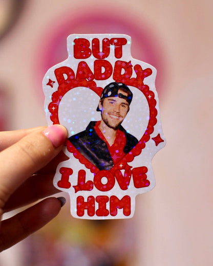 Heart-shaped sticker featuring Justin Bieber portrait, red outline, “But Daddy I love him”