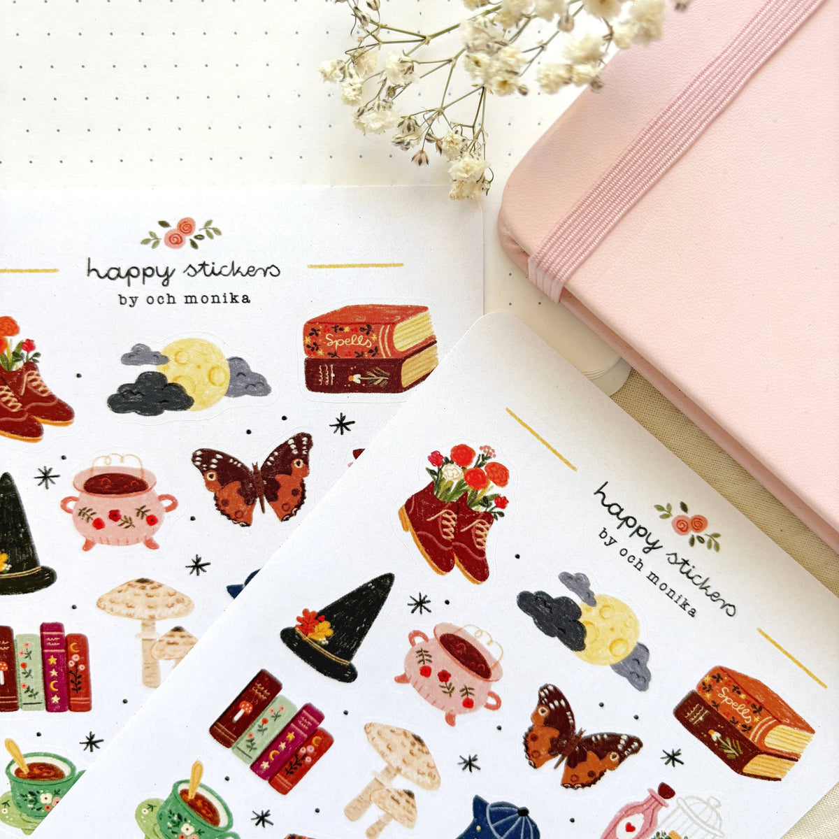 Witchy sticker sheet close-up with boots, moon, cauldron, book, flowers