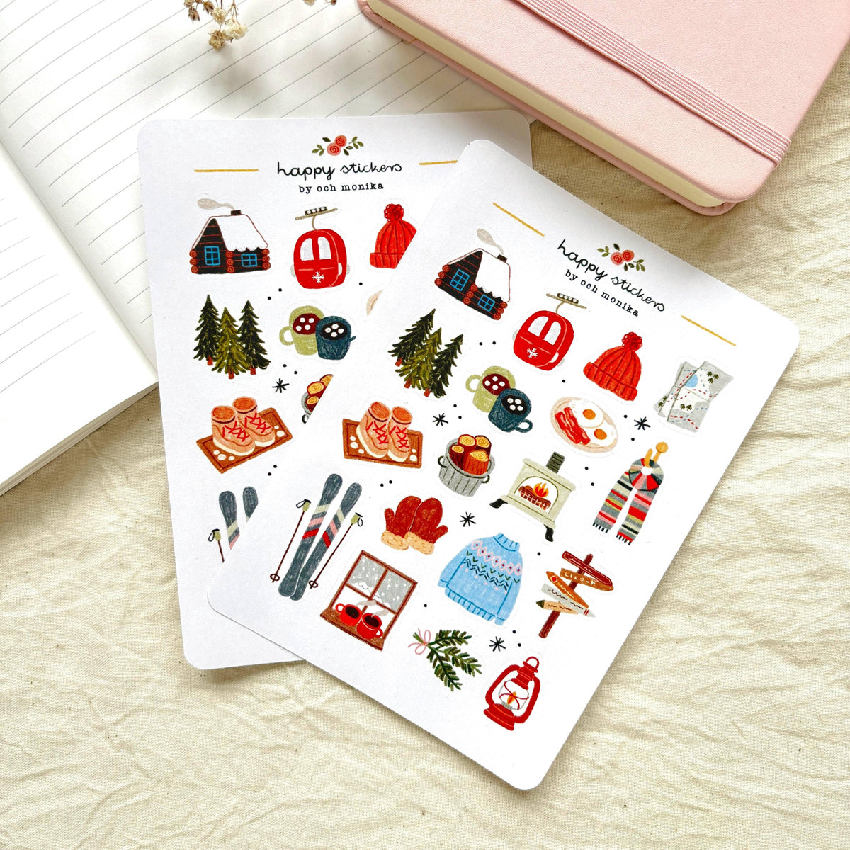 Sticker sheet set with winter stickers, showing cabin, lantern, skis, hat, and mittens