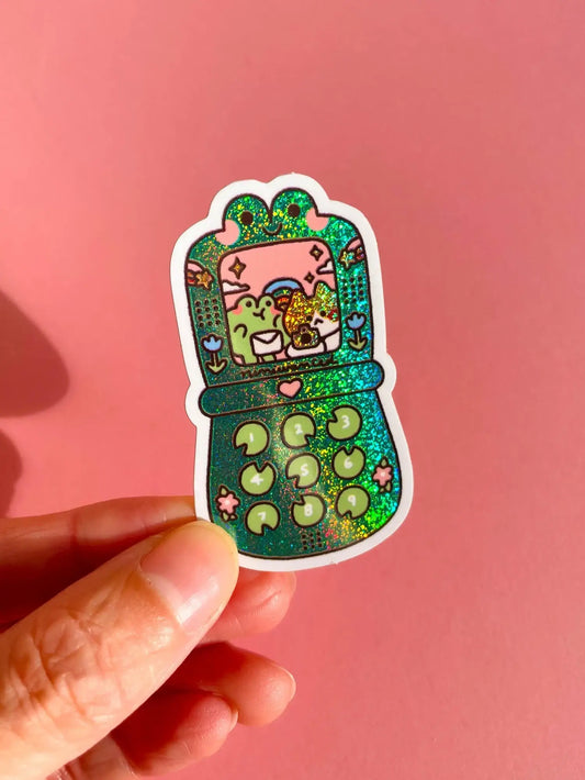 Green cartoon vinyl sticker with cute character inside a console