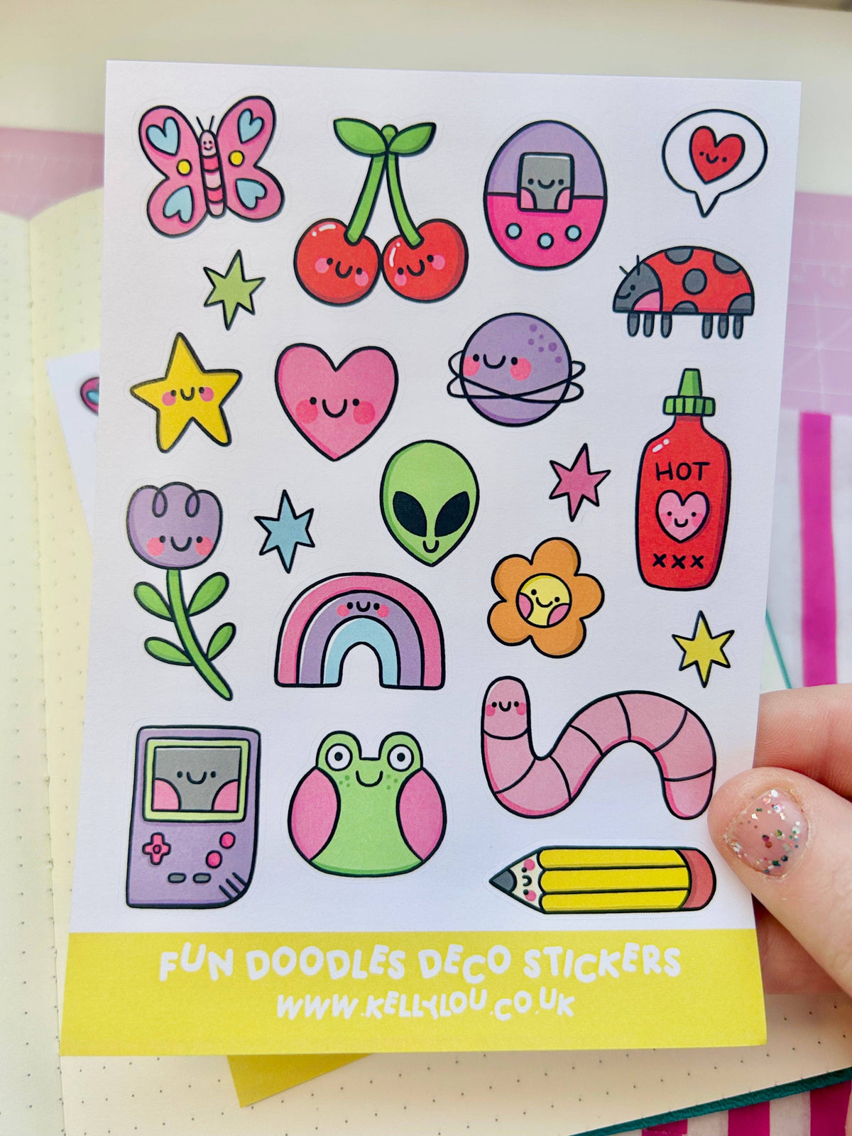 Deco sticker sheet with cute doodles: butterfly, hearts, alien, planet, hot drink, pencil