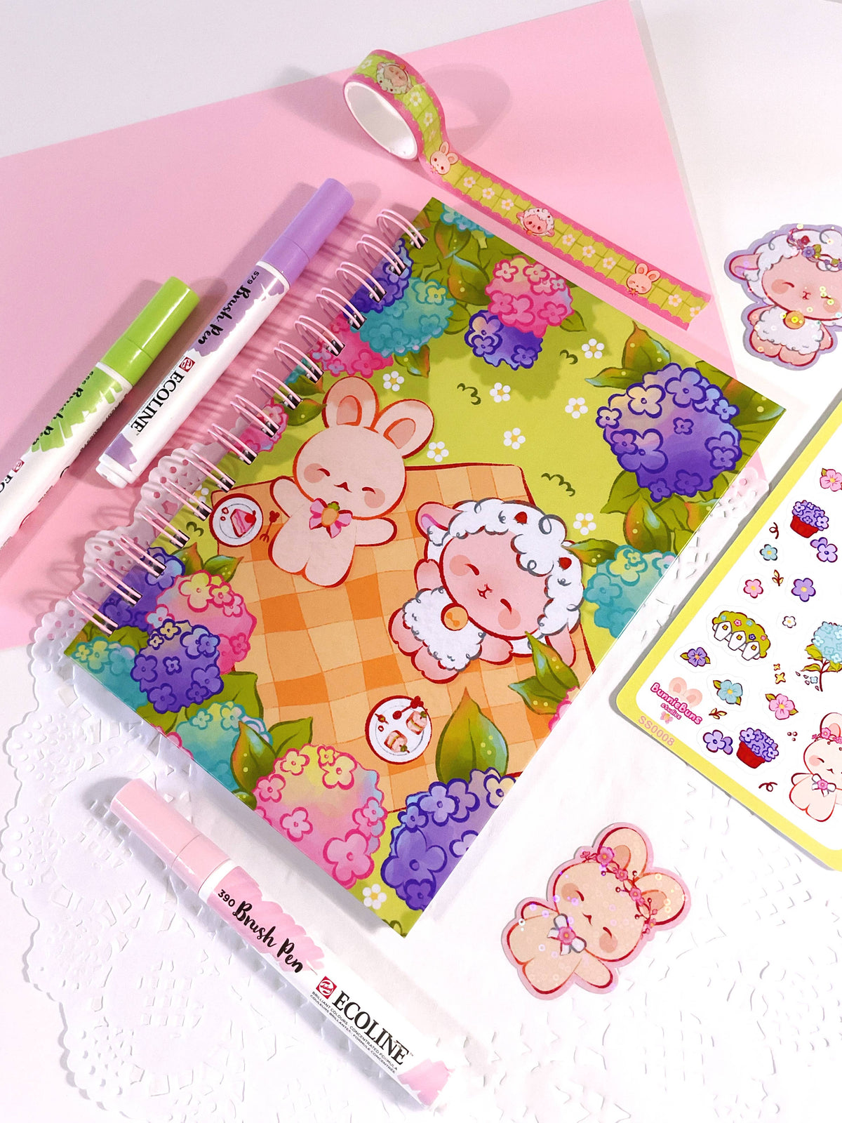 Colorful bunny and flower notebook cover with spiral binding, plus small character stickers