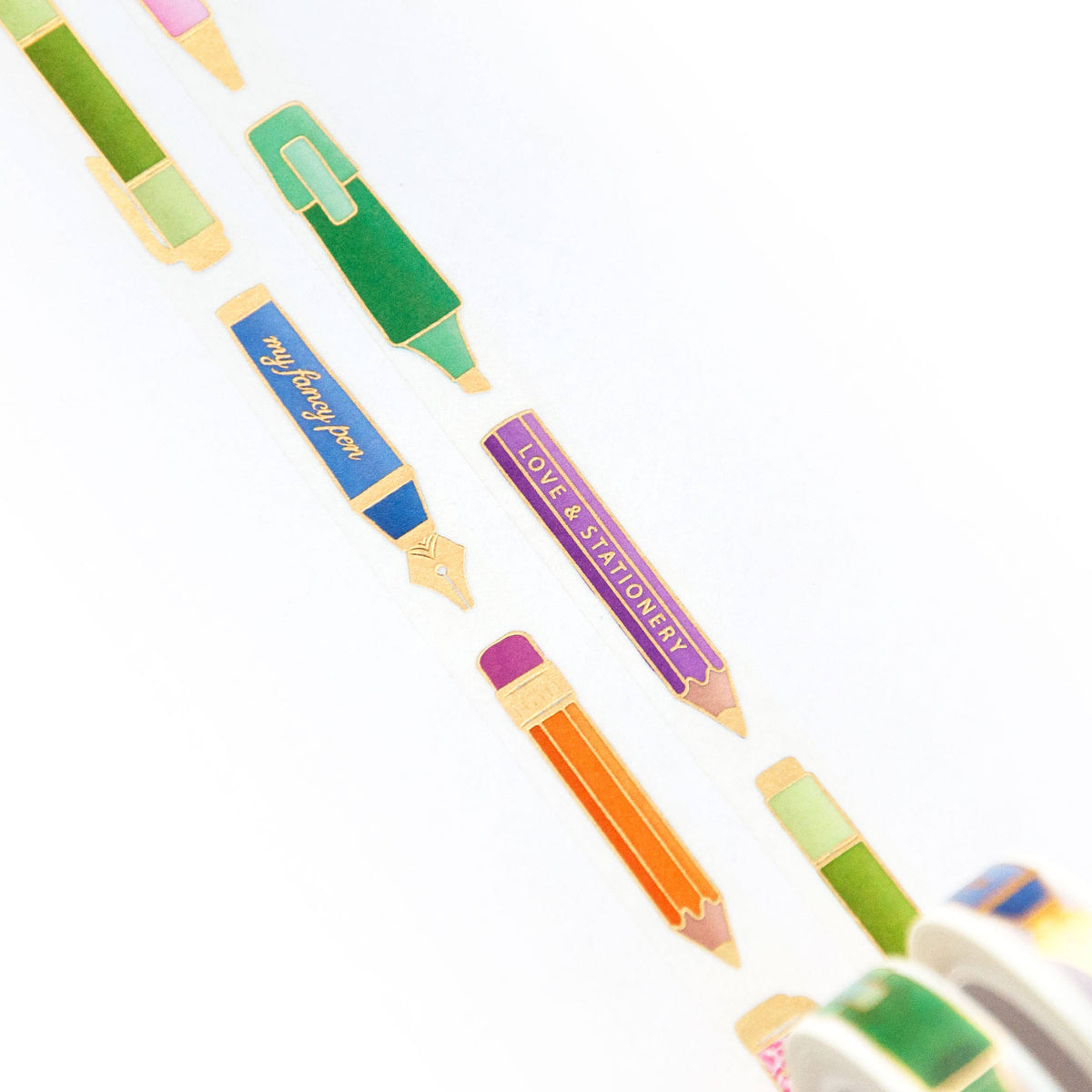 Washi tape roll with pen-themed strips in green, blue, orange, and purple
