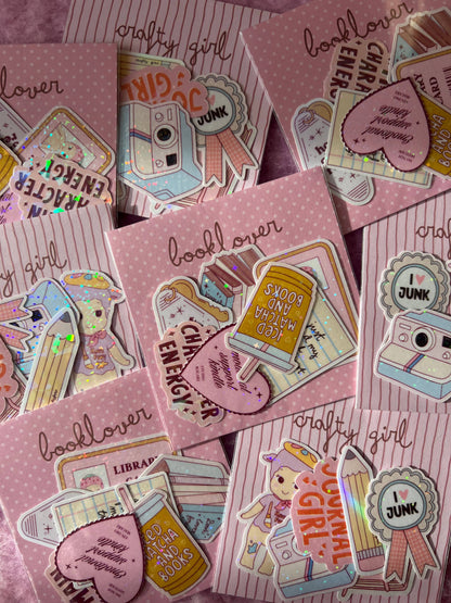 Crafty girl sticker pack with multiple camera and book-themed stickers plus round 'JUNK' badges