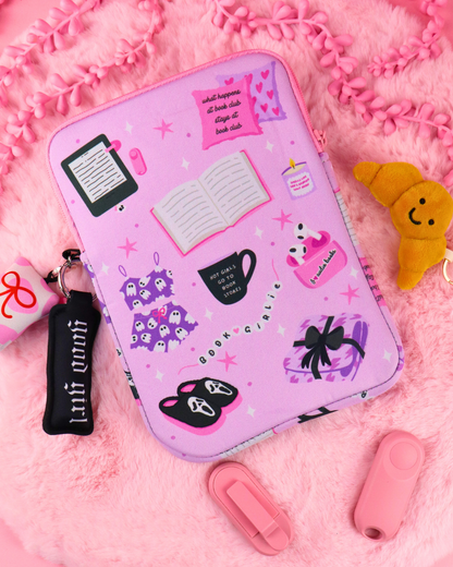 Lavender zipper book sleeve with character print and black strap attached