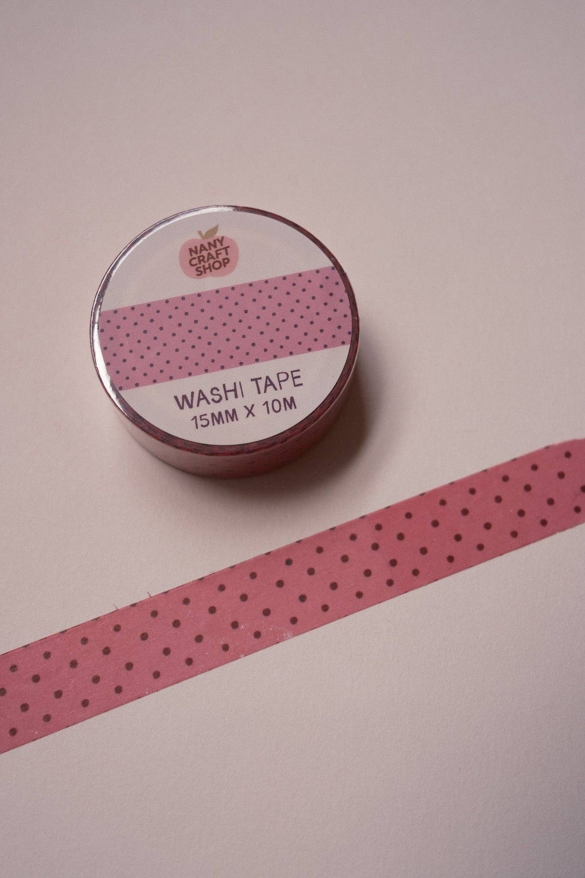 Pink polka dot washi tape roll with 15mm x 10m label, black dots