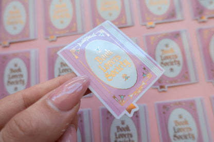 Vinyl sticker with light blue frame and gold "Book Lover's Society" lettering