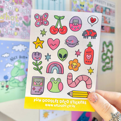 Deco sticker sheet with colorful cartoon icons: butterfly, cherries, alien, stars, pencils