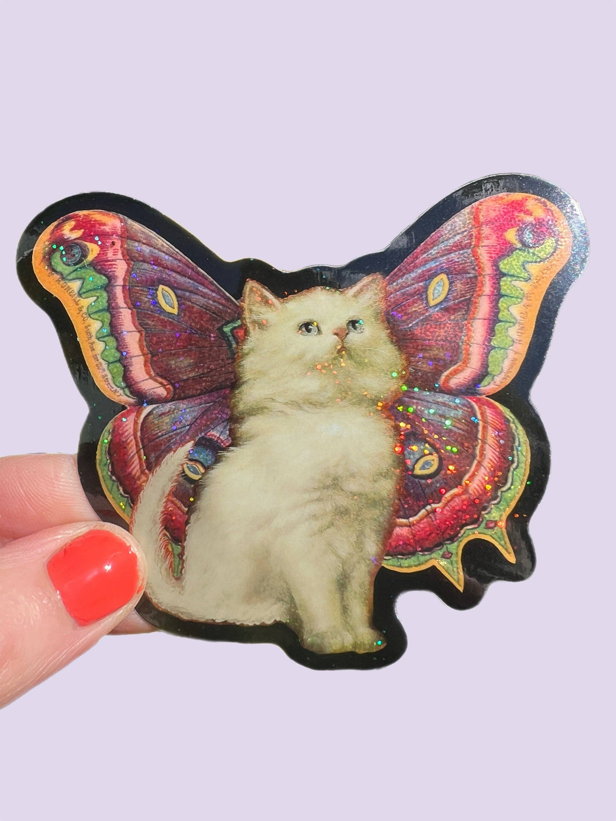 Single cat butterfly glitter sticker featuring a kitten with multicolor wings and black border