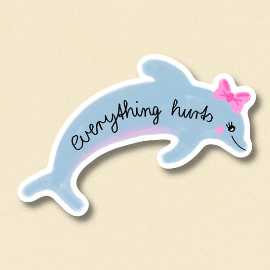 Blue dolphin sticker with 'everything hurts' script, pink bow and smiley eye