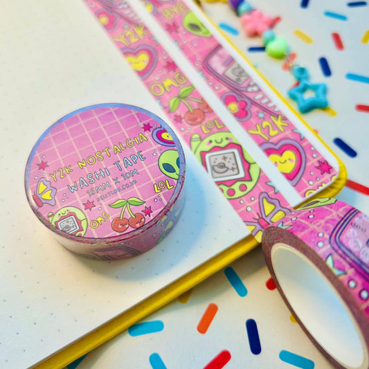 Pink Y2K-themed washi tape roll and long strips with colorful candy graphics