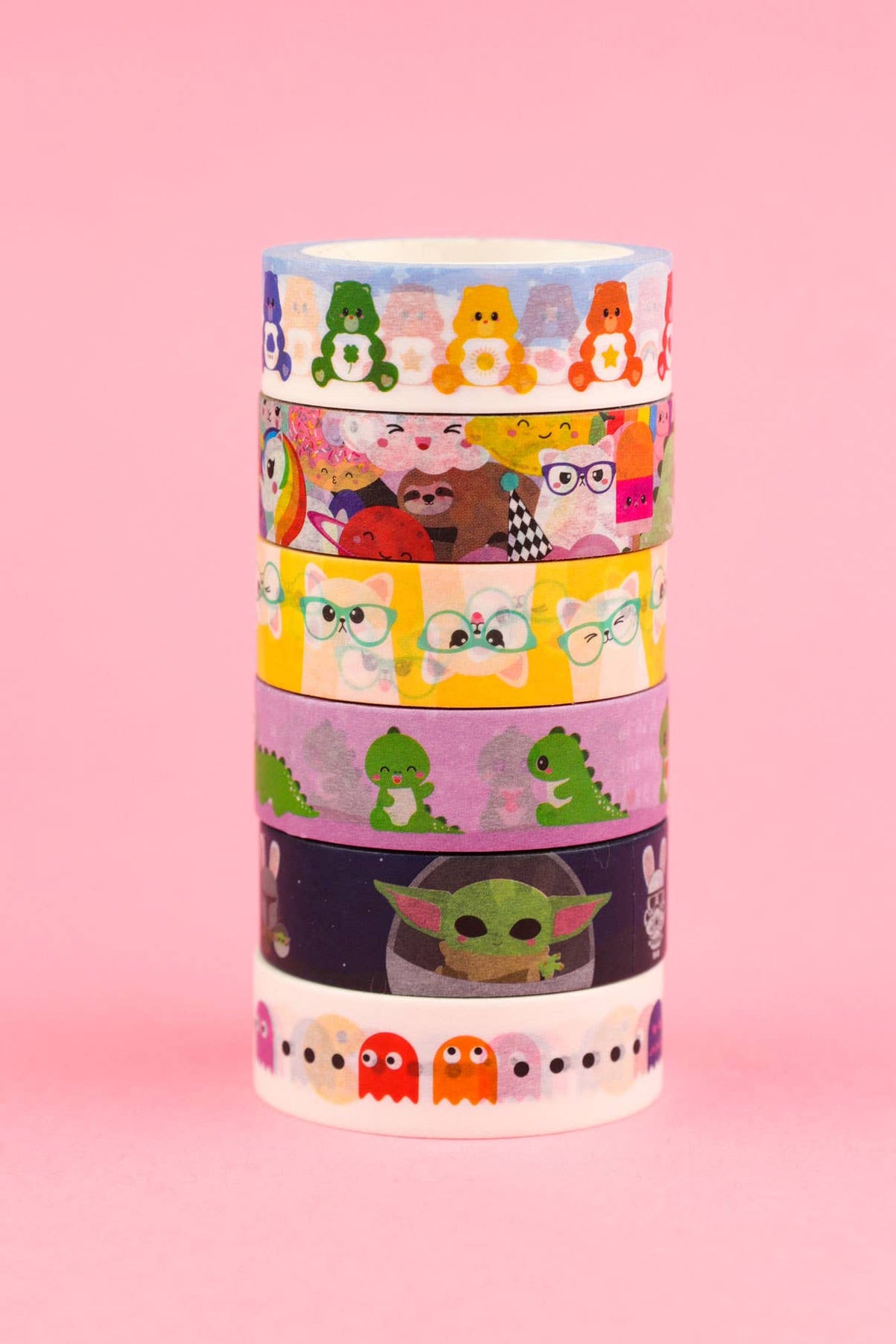 Stacked Care Bears washi tape rolls with layered character faces on transparent tape