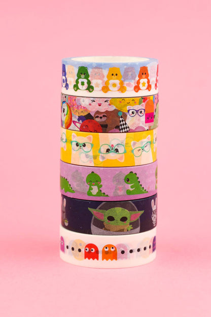 Stacked Care Bears washi tape rolls with layered character faces on transparent tape