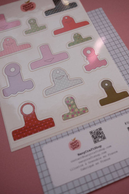Board clamps sticker sheet with multiple T-shaped pieces and grid ruler underneath
