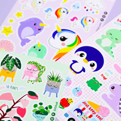 Sticker sheet close-up with penguin characters, plants in pots, and colorful animal stickers