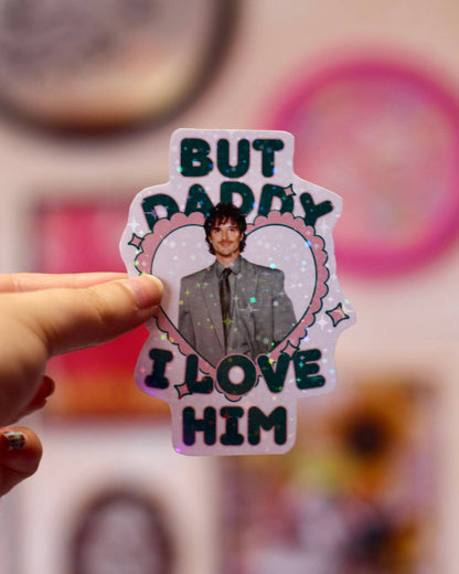 Heart-shaped holographic sticker featuring a man portrait and text BUT DADDY LOVE HIM