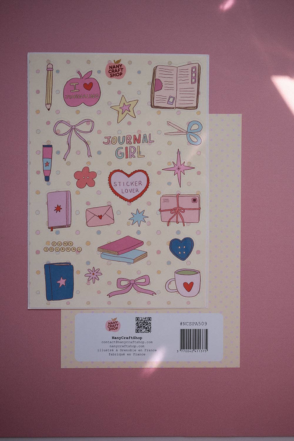 A5 sticker sheet with pink and blue stationery stickers and a barcode label at bottom