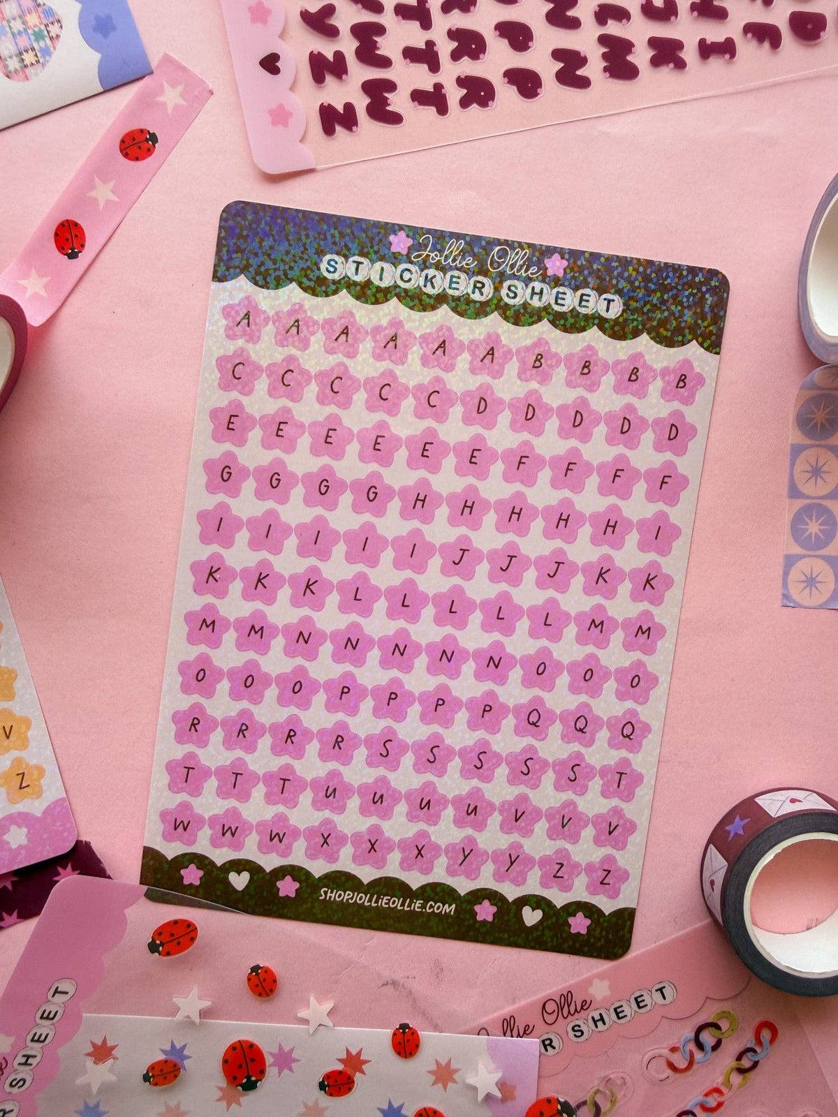 Pink alphabet sticker sheet with letter stickers arranged in neat rows