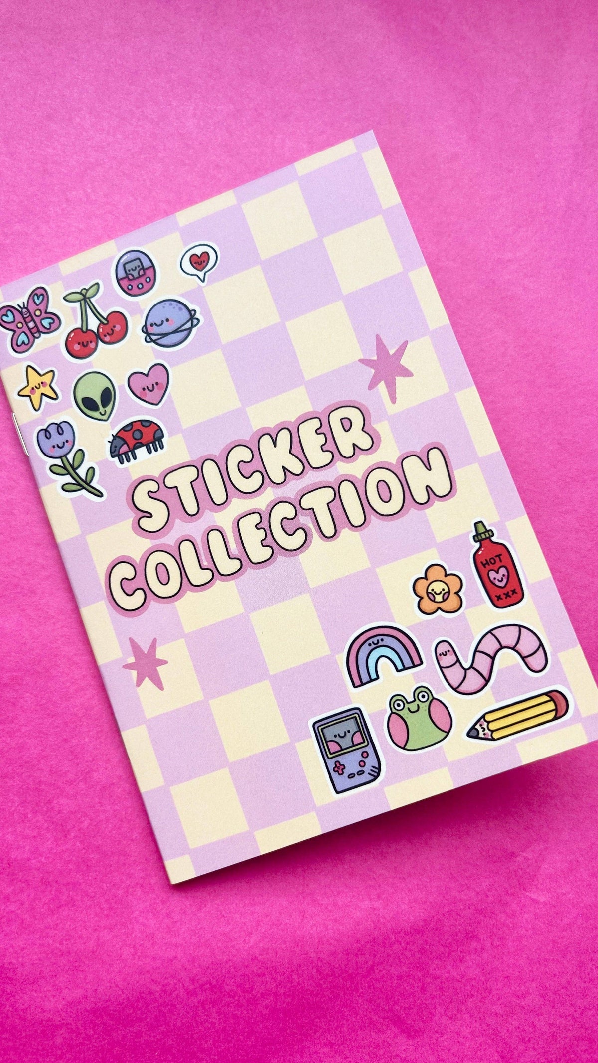 A6 mini reusable sticker book lying flat with sticker collection title on cover