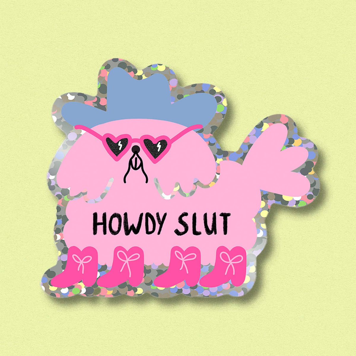 Glitter sticker of pink cartoon character with heart eyes and the text 'Howdy Slut'.