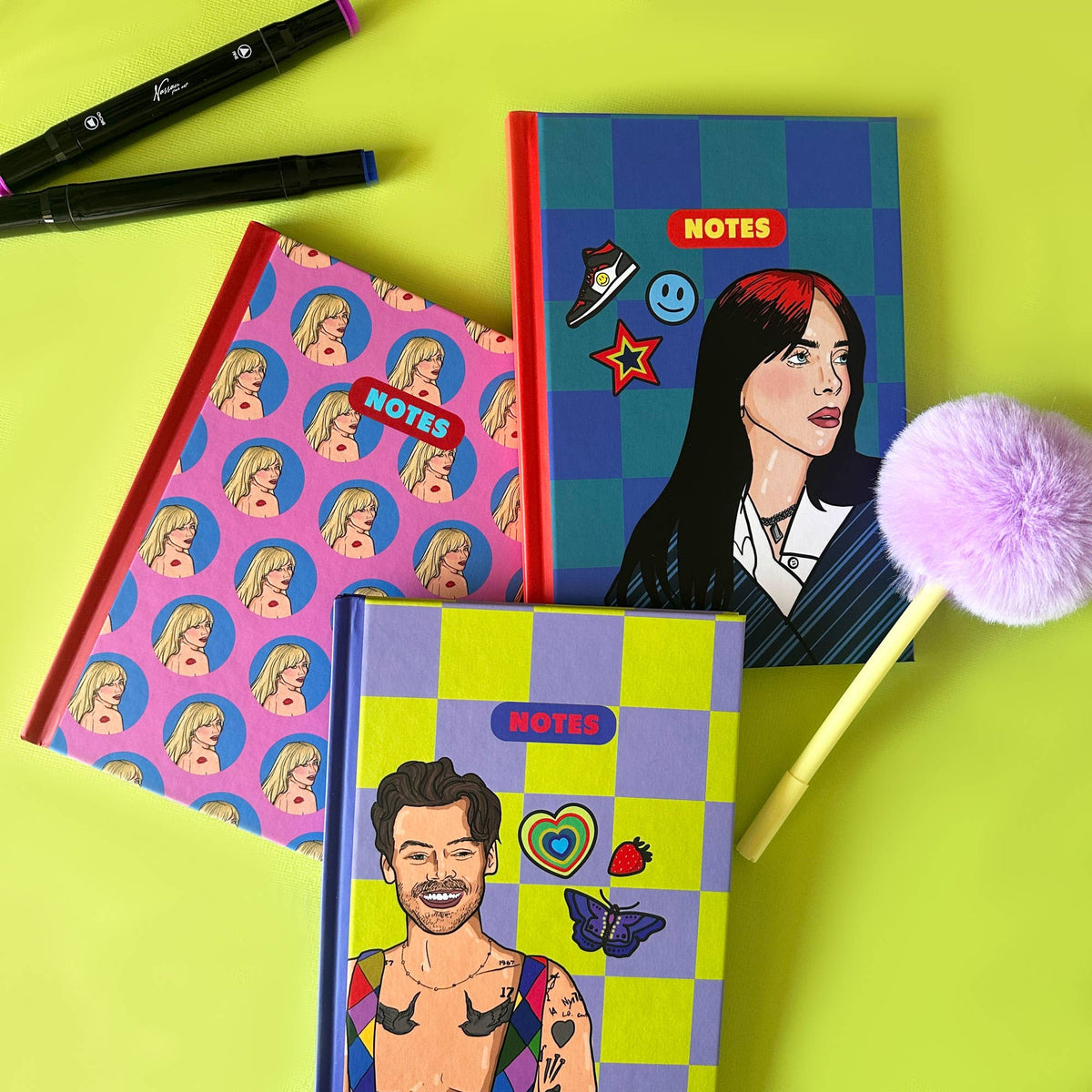 Set of A5 notebooks with “NOTES” badges: purple face pattern, blue check design, and illustrations.