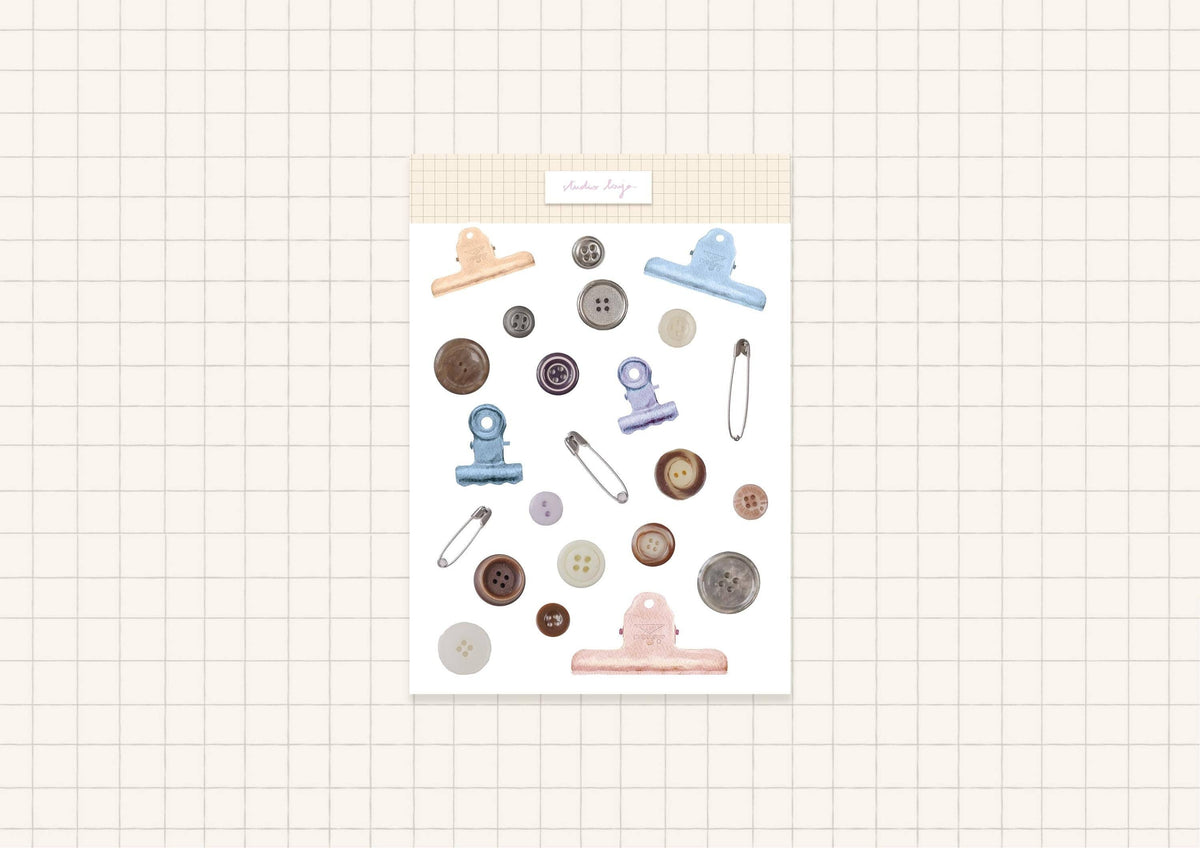 Button-themed sticker sheet with pastel clips, needles, and round button icons